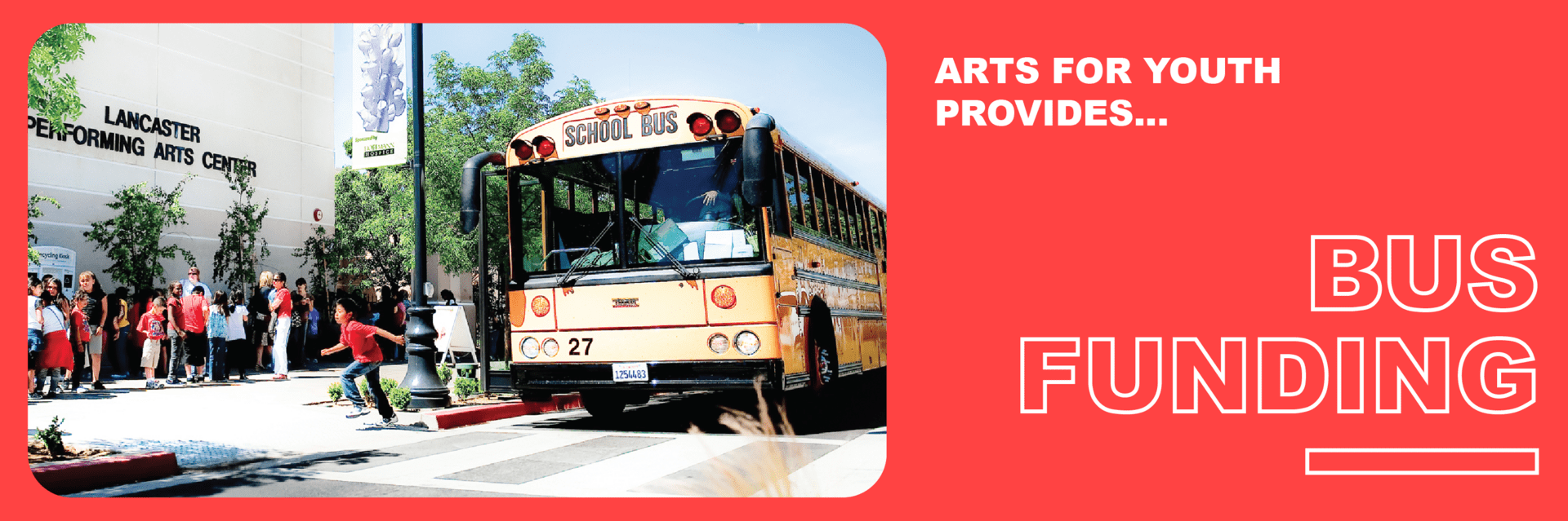 School bus at Performing Arts Center entrance.